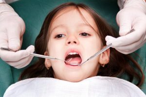 young girl receiving dental work