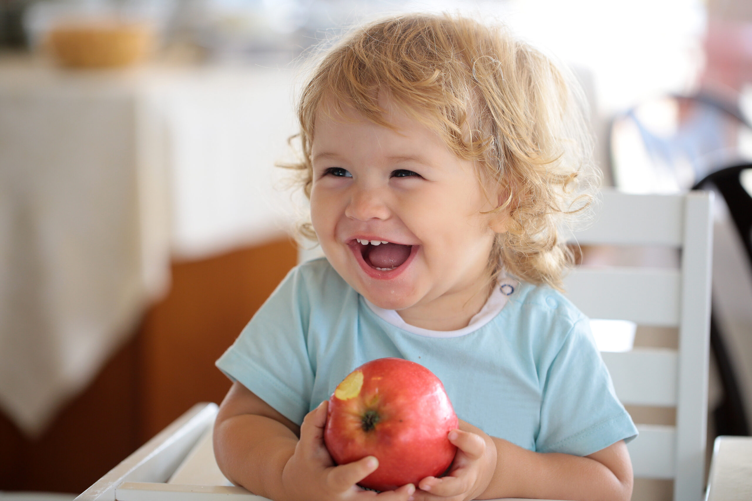 Young boy eating apple as recommended by Irving kid’s dentist