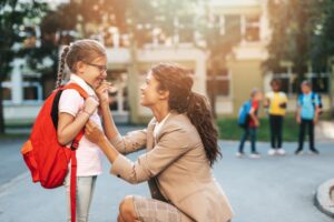 parent sending their child to school