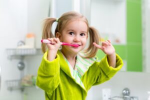 child brushing their teeth